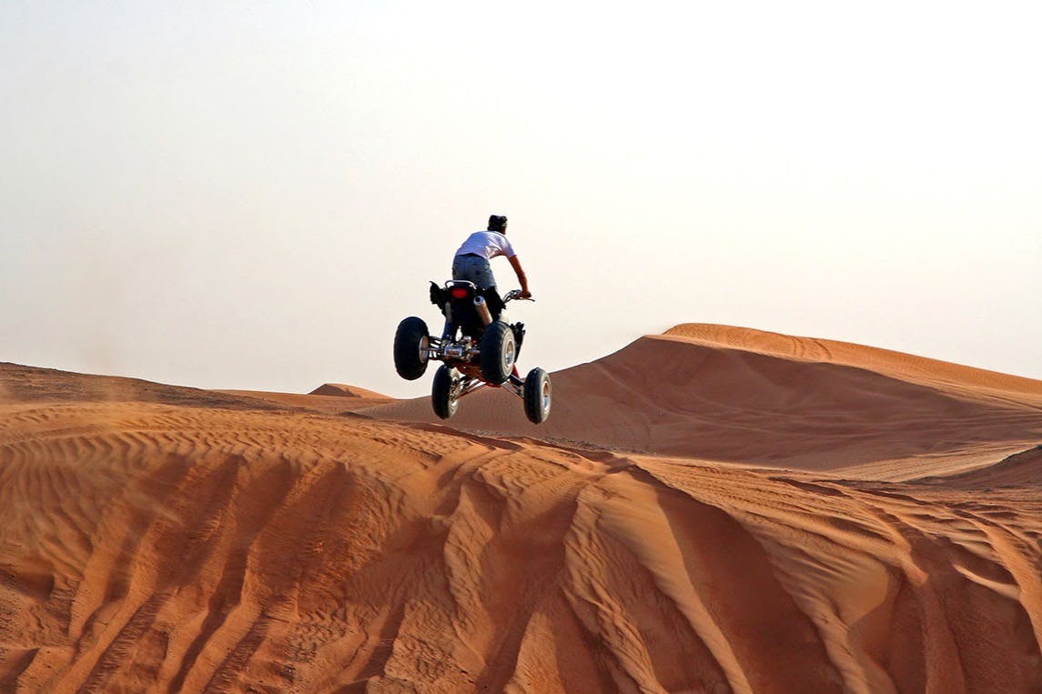 Morning Safari: Quad Bike, Sandboarding & Camel Ride