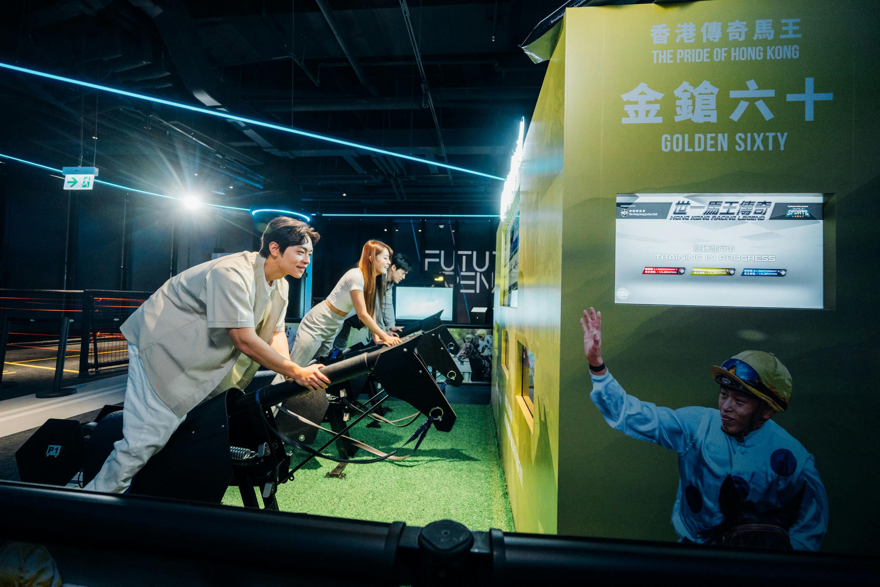 People interacting with horse racing simulators in an indoor exhibition space with vibrant lighting and displays.