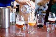 Pouring different styles of Scottish beer into tasting glasses