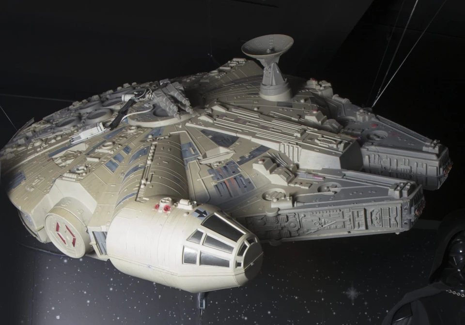 Detailed model of a spacecraft with various compartments and antenna systems against a starry dark background.