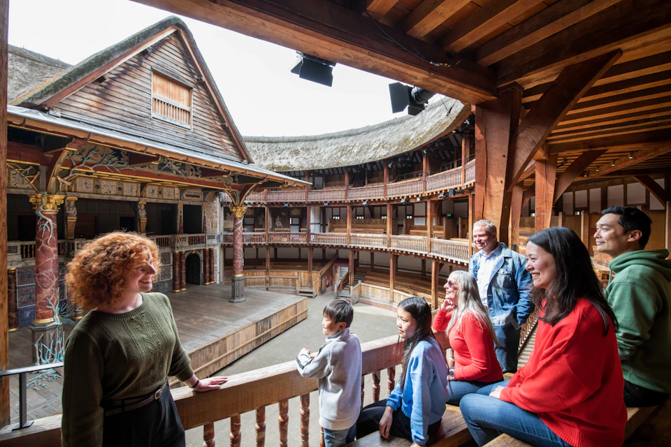 A tour group booking out at the Globe Stage in the Middle Gallery of the Globe Theatre.