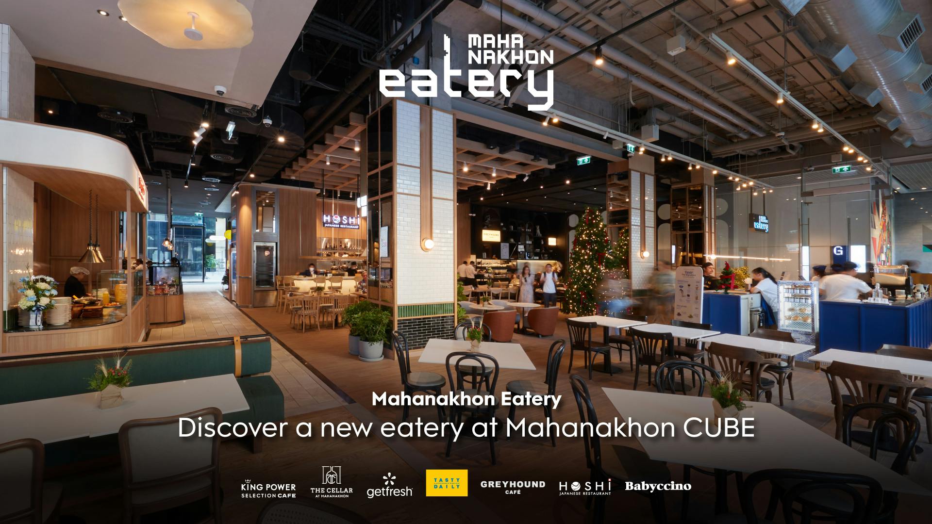 Modern dining area with various seating options, illuminated decor, and multiple food vendor signs. Text: "Mahanakhon Eatery. Discover a new eatery at Mahanakhon CUBE." Logos of associated brands at the bottom.