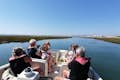Guests enjoying an eco boat tour from Faro into Ria Formosa