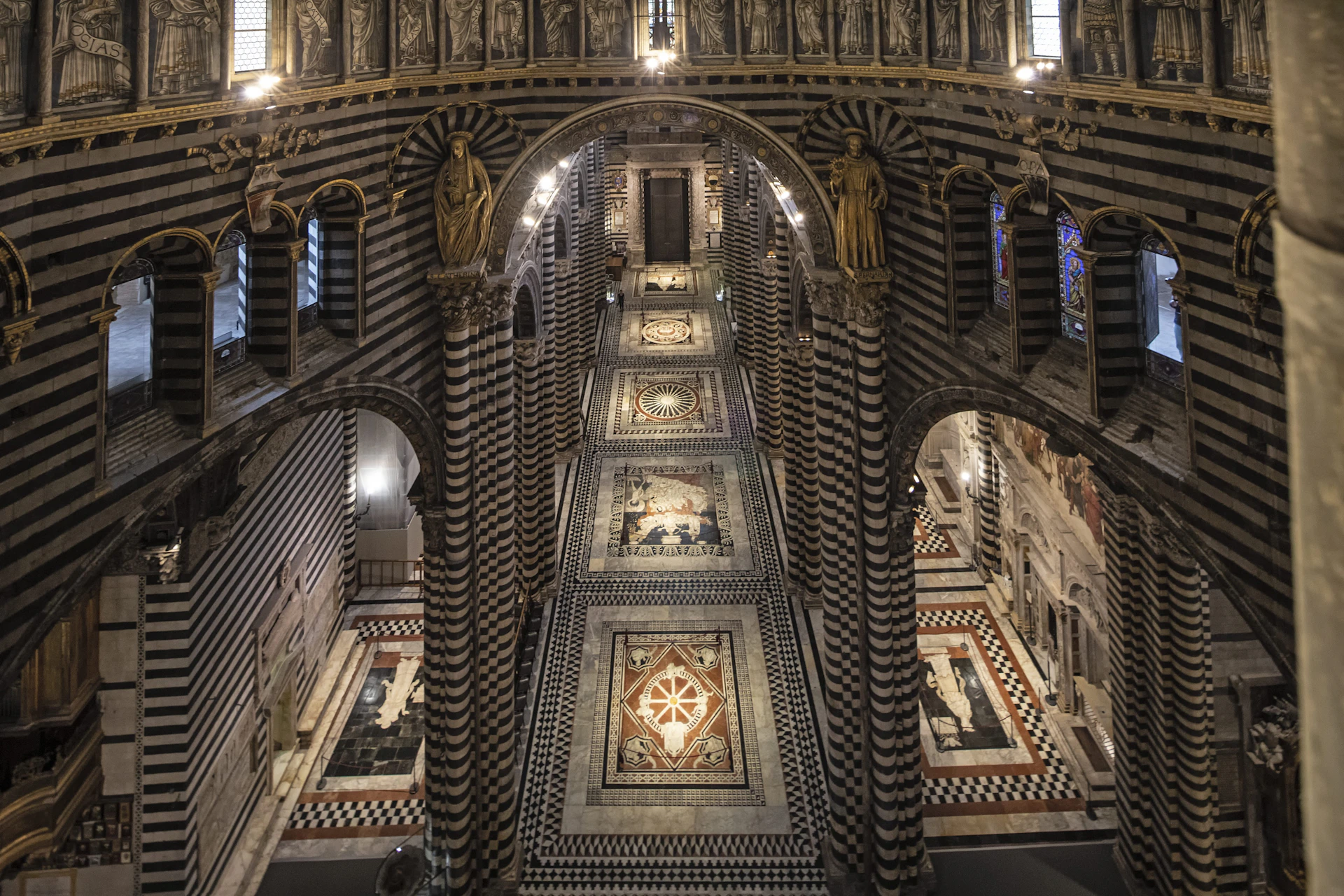 View of the uncovered floor of the Siena Cathedral from the Gate of Heaven