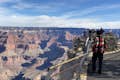 view of grand canyon with tourists on the lookout