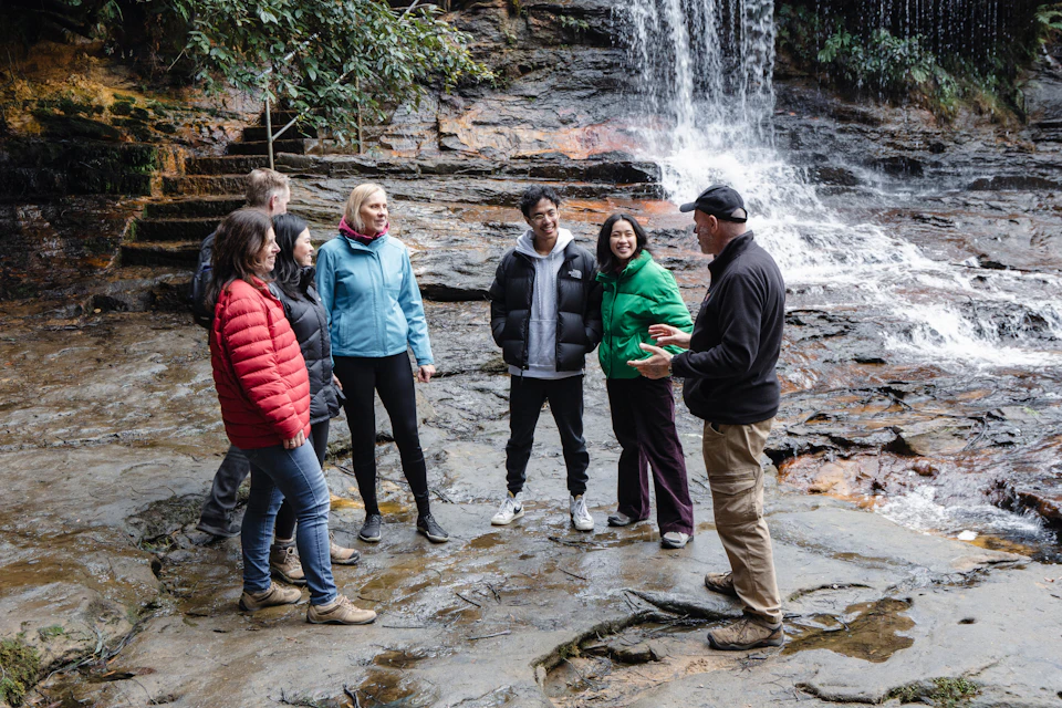 Tour guide and group at the top of the waterfall at Wentworth Falls