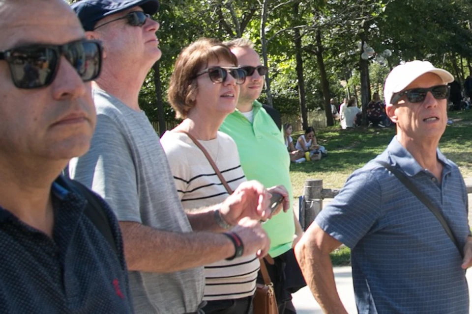 Capture a vibrant moment of our tour group exploring the charming streets of DUMBO.