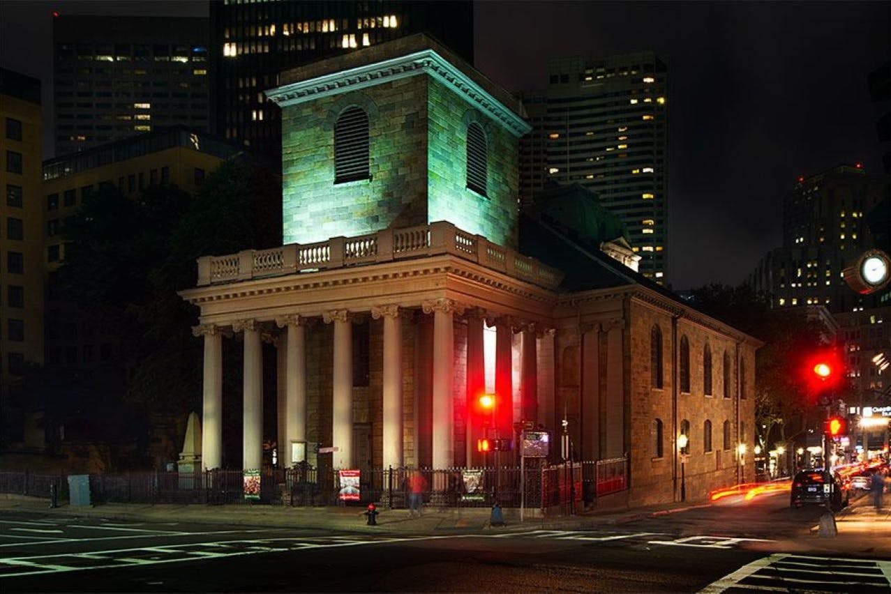 Nighttime photo of the King's Chapel Church in downtown Boston