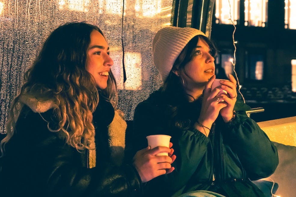 Girls enjoying warm drinks on our cozy boat