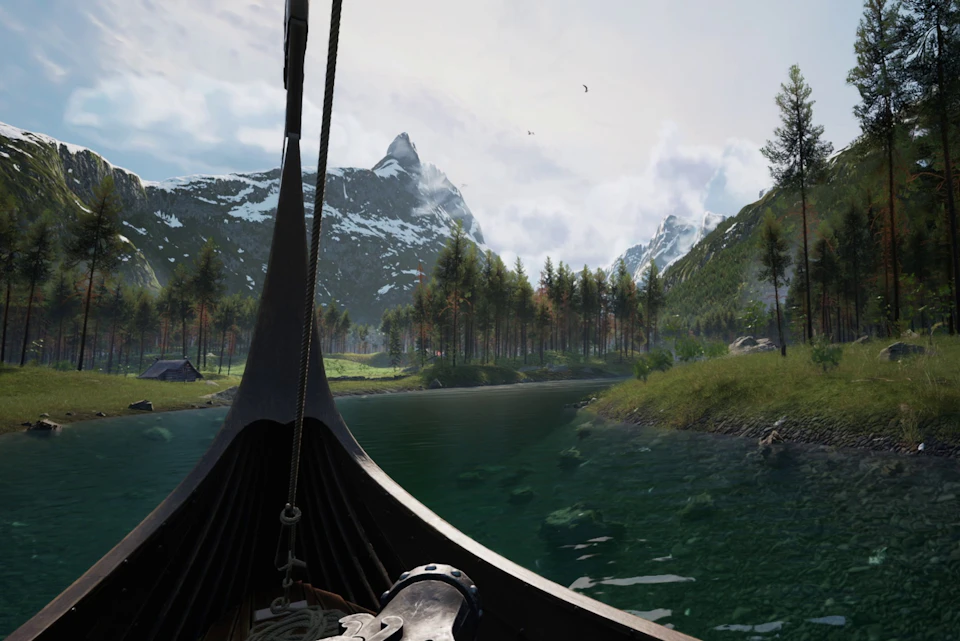 A serene mountain lake surrounded by snowy peaks and forests, with the bow of a boat in the foreground.