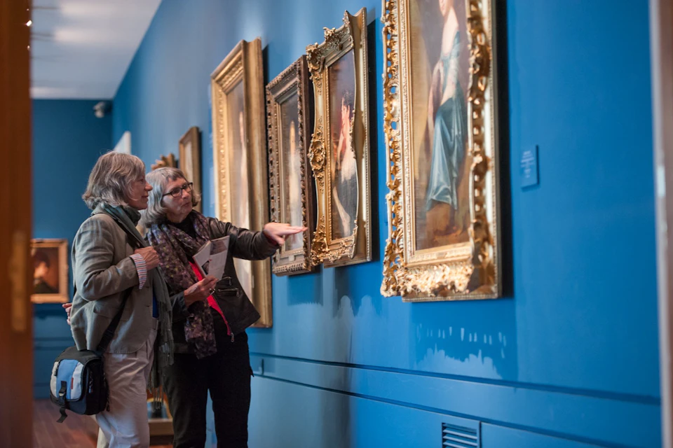 Visitors gazing at painting at Lazaro Galdiano Museum