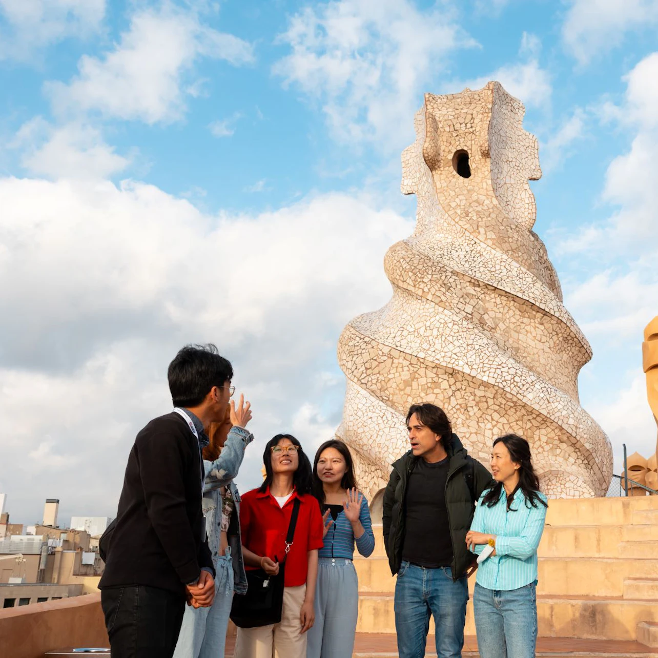 Visitors enjoy the views from the rooftop of La Pedrera