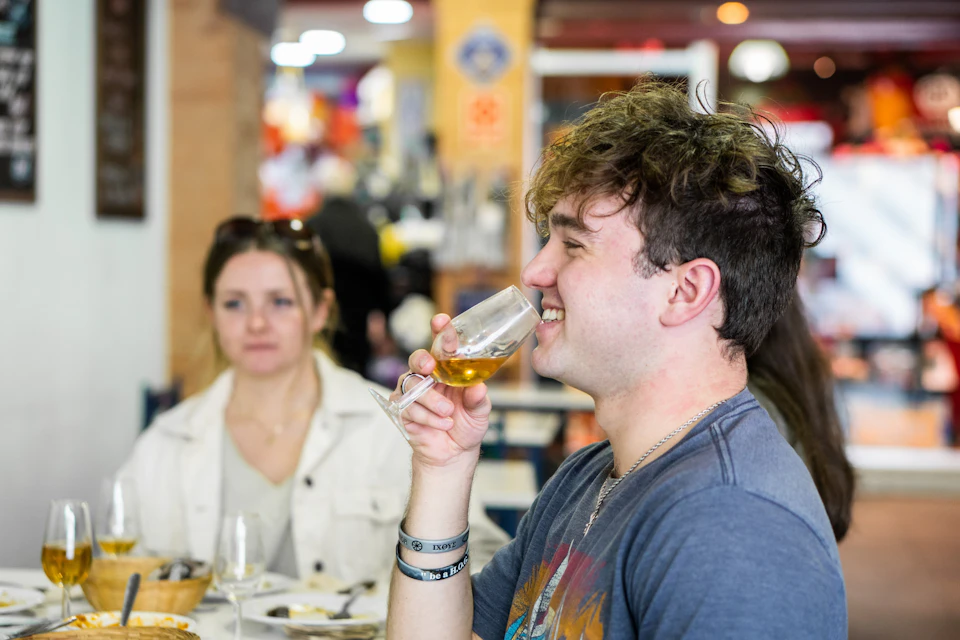 Enjoying a manzanilla and tapas