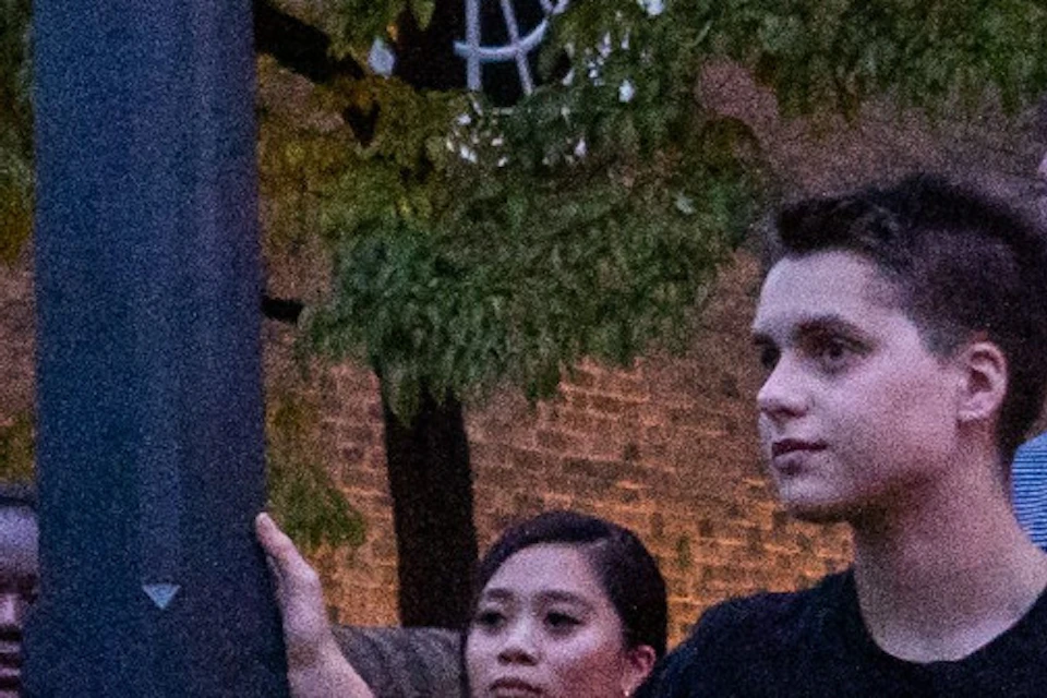 Tour guides holding a lantern having a great time with guests.