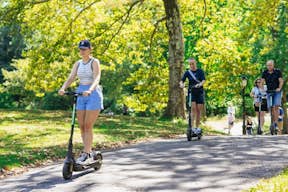 happy customers riding scooters