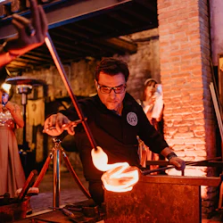Master at work with glowing glass