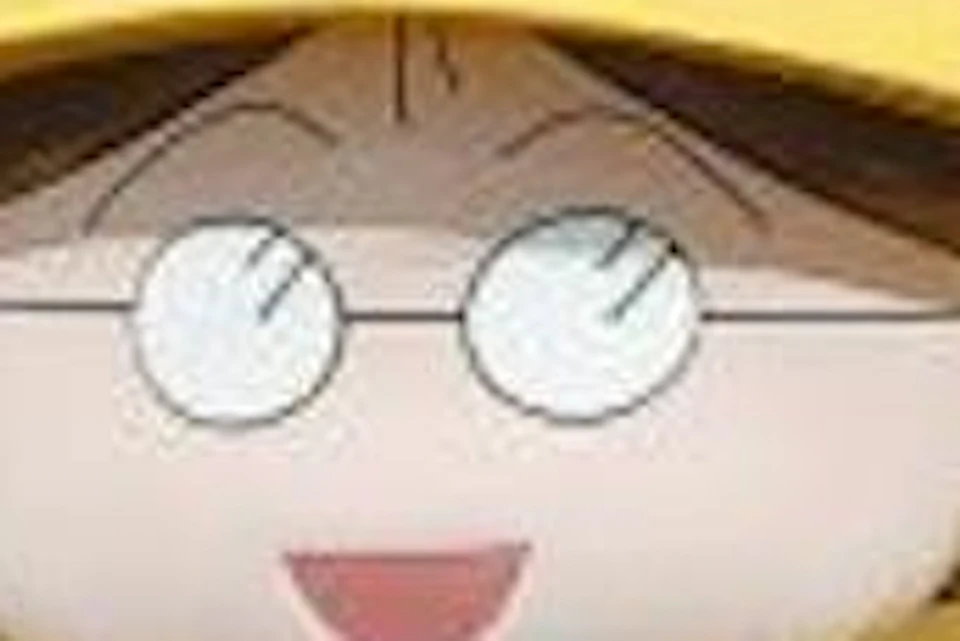 A cartoon-style statue of a girl with glasses and braids wearing a yellow hat sitting on a bench in a playful setting.