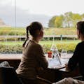 Couple admiring the sumptuous view of the abbey while having a lovely lunch