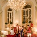 Opera singers and an instrumental ensemble dressed in authentic Baroque costumes