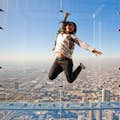 Woman jumping on ledge at Skydeck in chicago