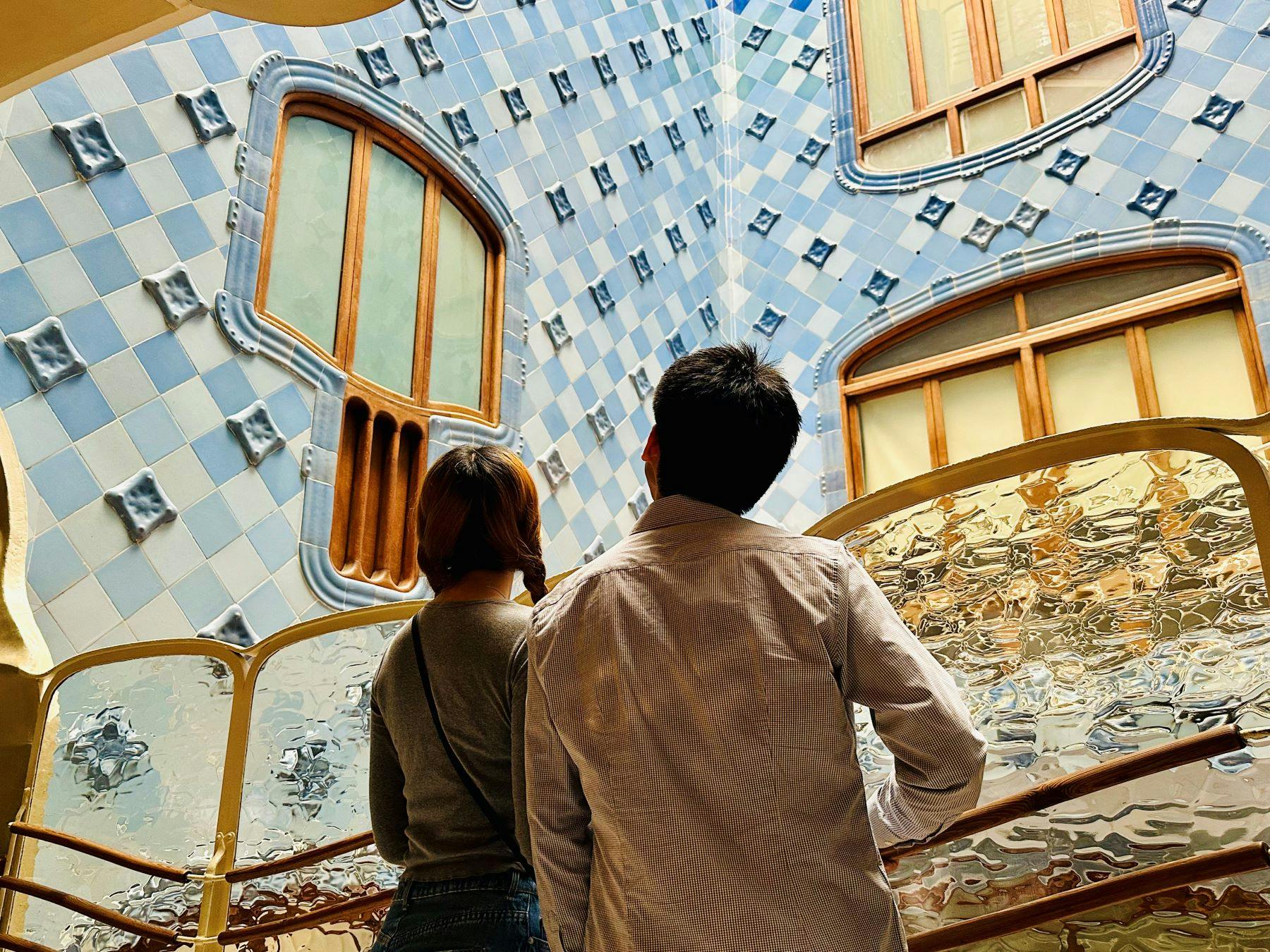 People admiring the tiles at Casa Batlló
