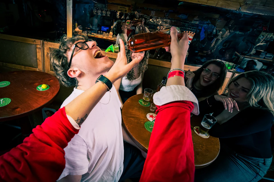 Image of a guest taking a shot