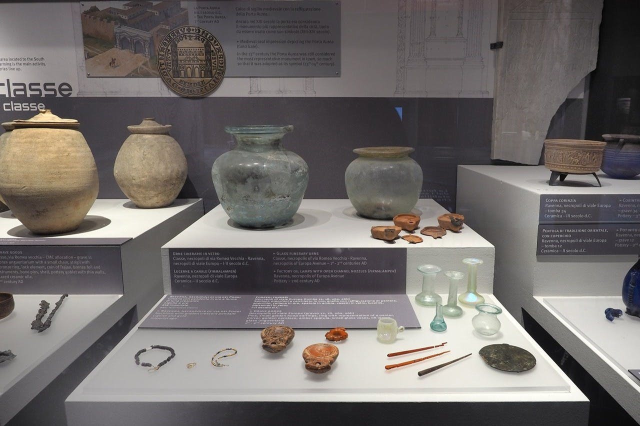 Glass funeral urns and factory oil lamps with open channel nozzles