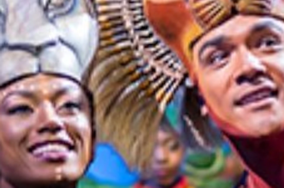 Performers in colorful costumes and lion masks on stage with a jungle-themed backdrop.