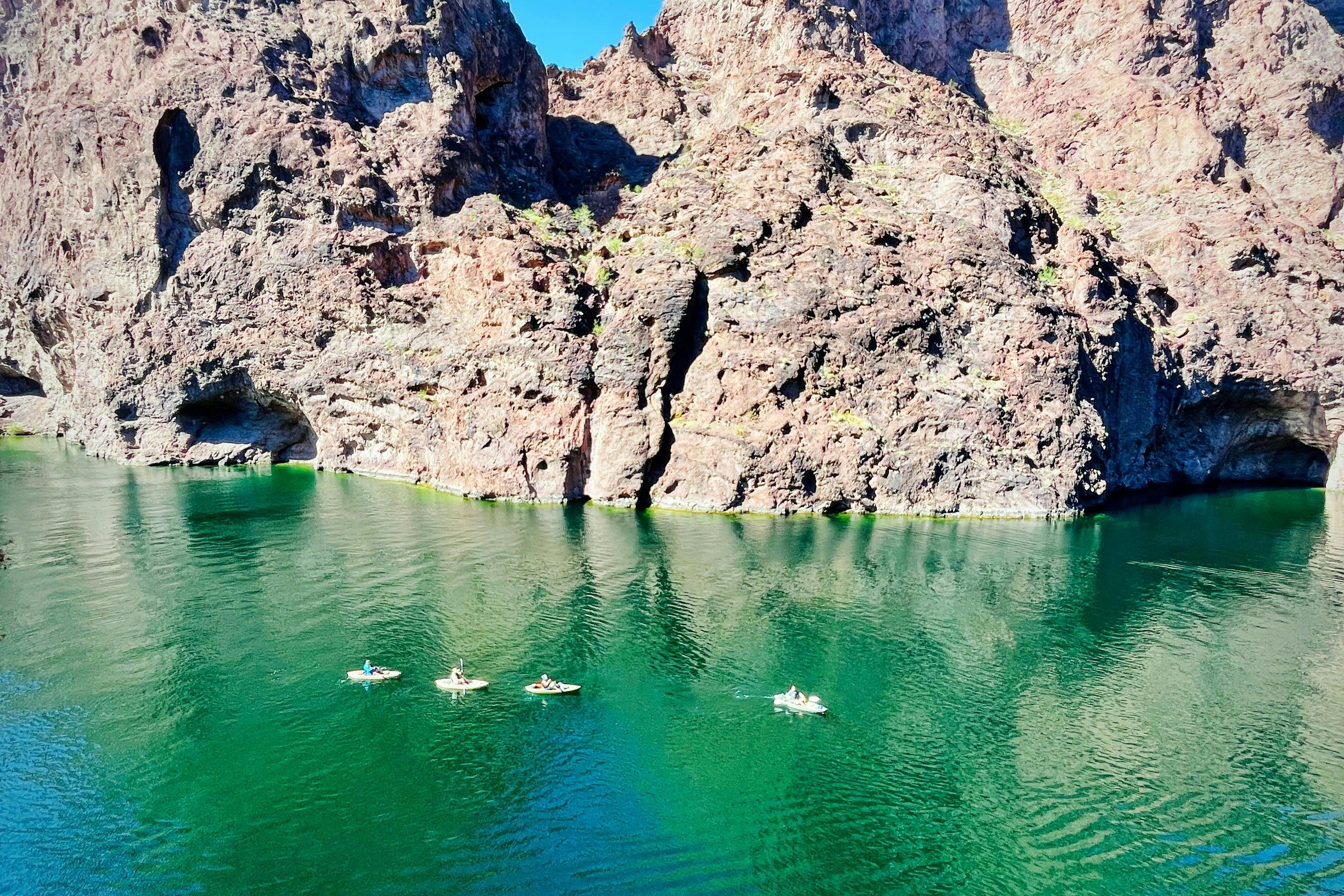 Kayakers paddle between Emerald and Echo Cave