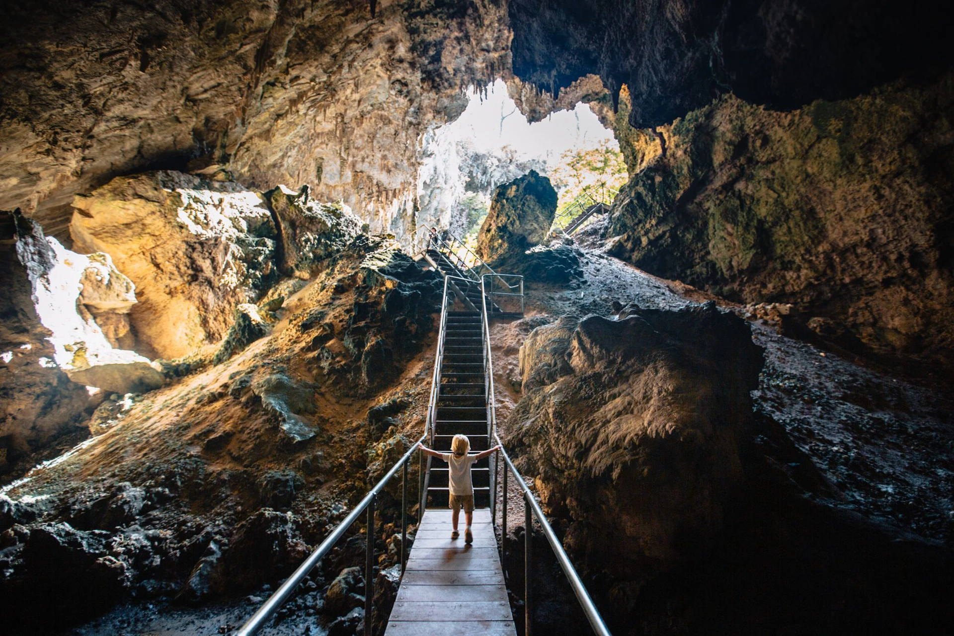 Emerge from the cave into a spectacular doline