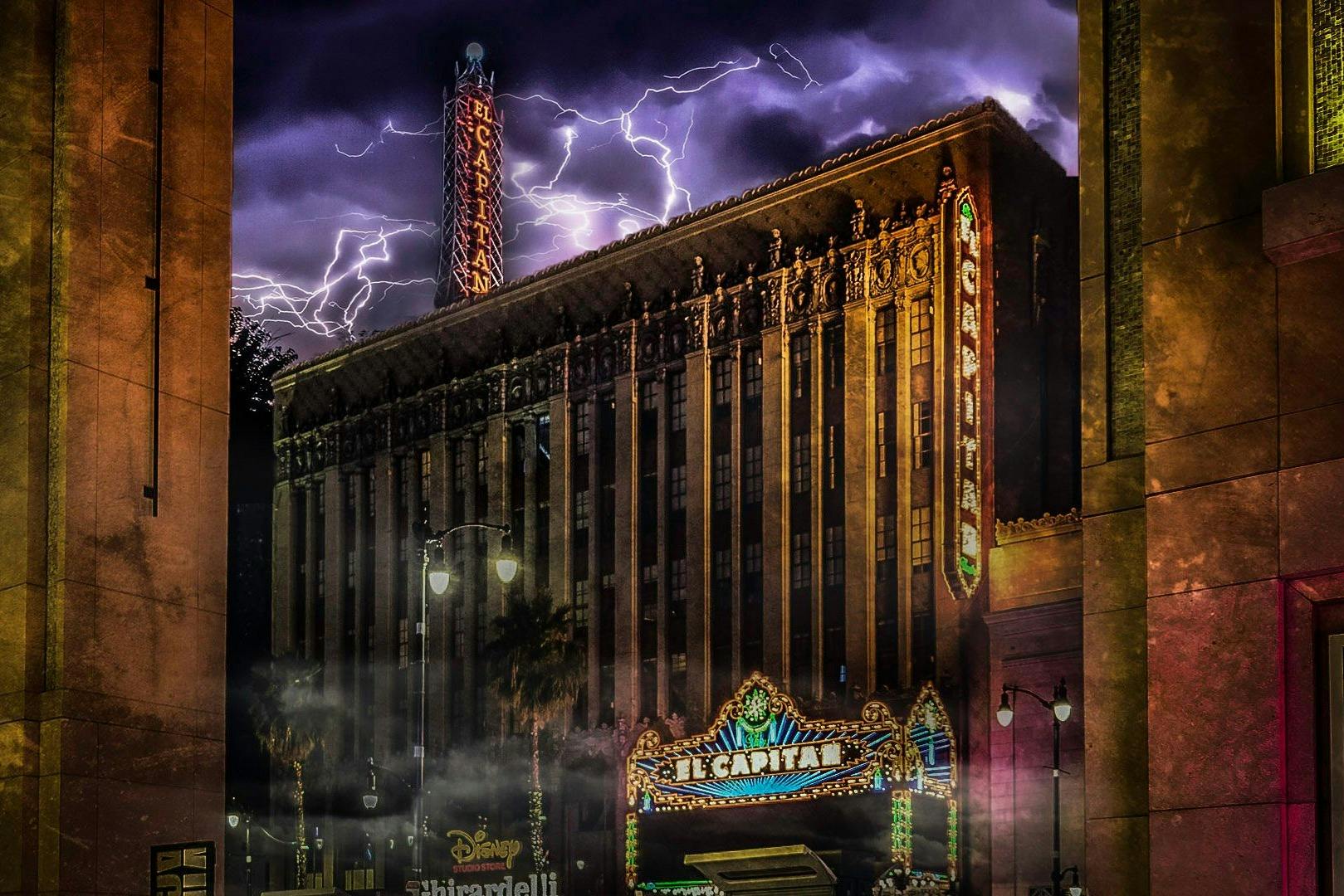 Photo of the El Capitan Theatre in LA, with lightning and clouds overhead