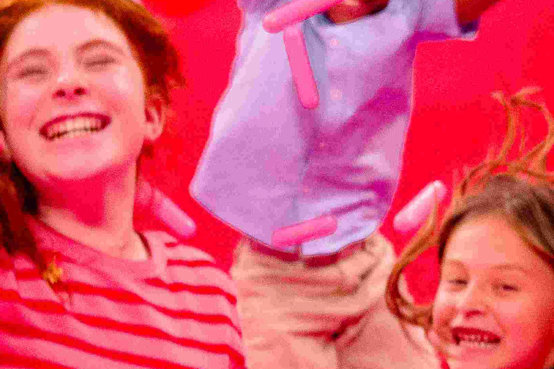 People having fun in a large pool filled with pink plastic sprinkles at the Museum of Ice Cream.