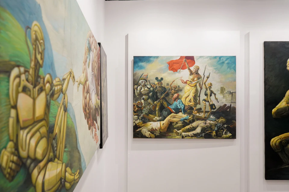 A gallery wall displaying colorful paintings, including a reimagined version of "Liberty Leading the People."