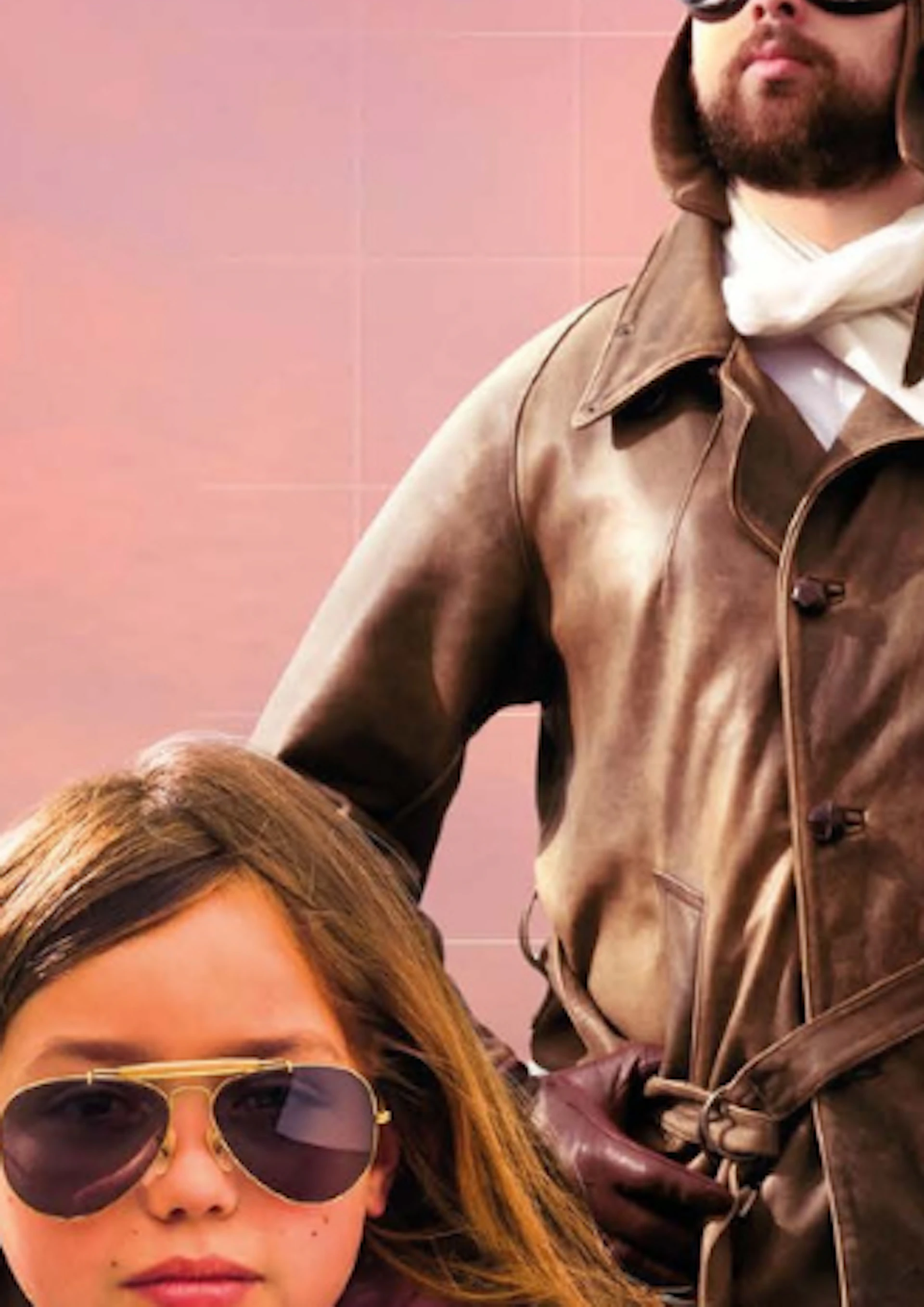 A man in vintage aviator clothing and a young girl in casual wear are posed near a small airplane with a map in the background.