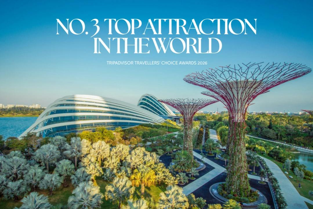 Modern architecture and large tree-like structures in a garden with text about being a top attraction in the world.
