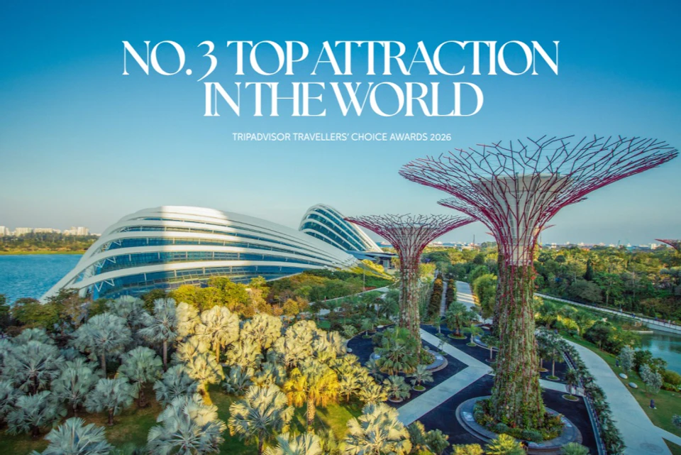 Modern architecture and large tree-like structures in a garden with text about being a top attraction in the world.