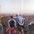 Two people viewing Central Park from north side of Top of the Rock Observation Deck 