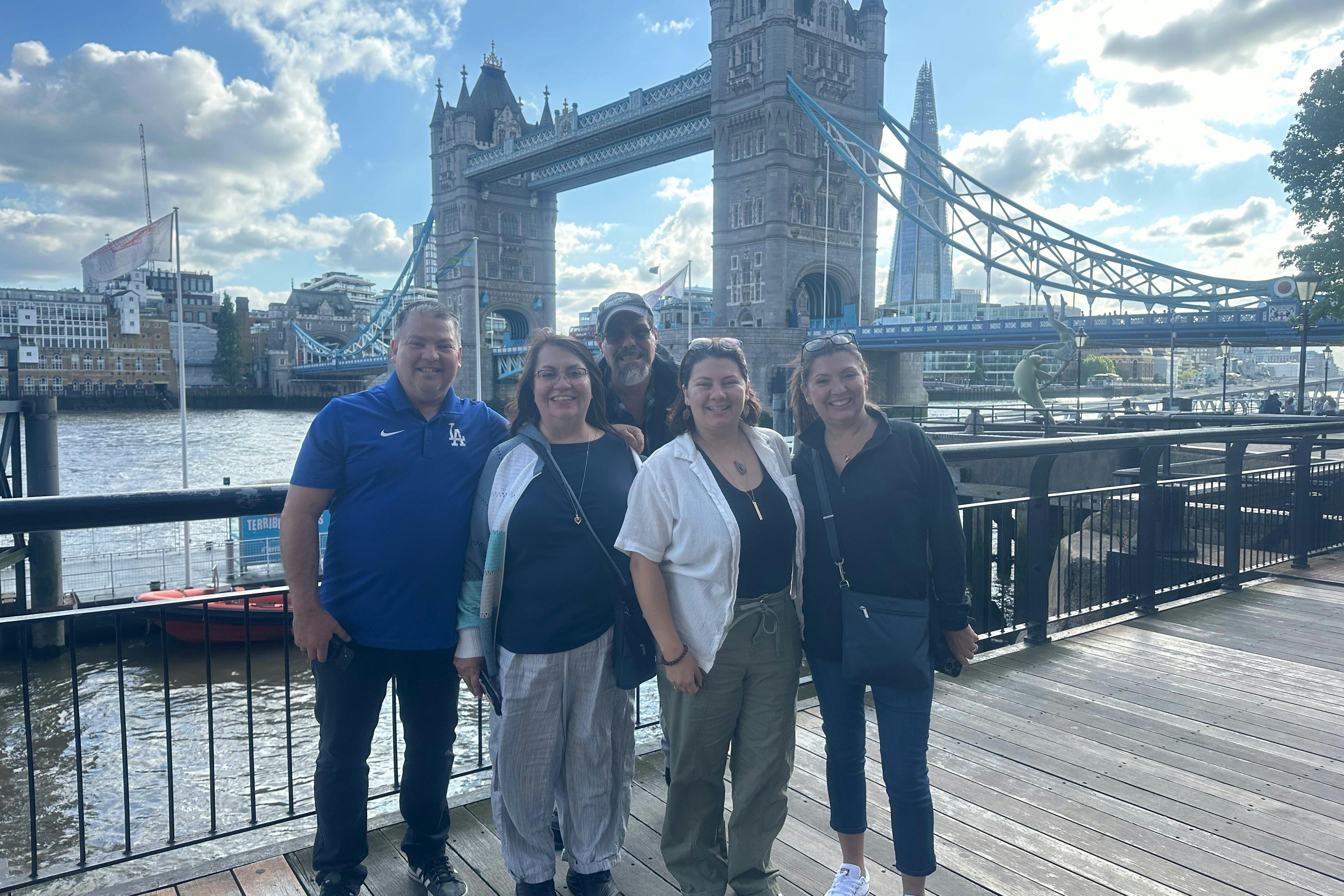 Family standing near Tower Bridge