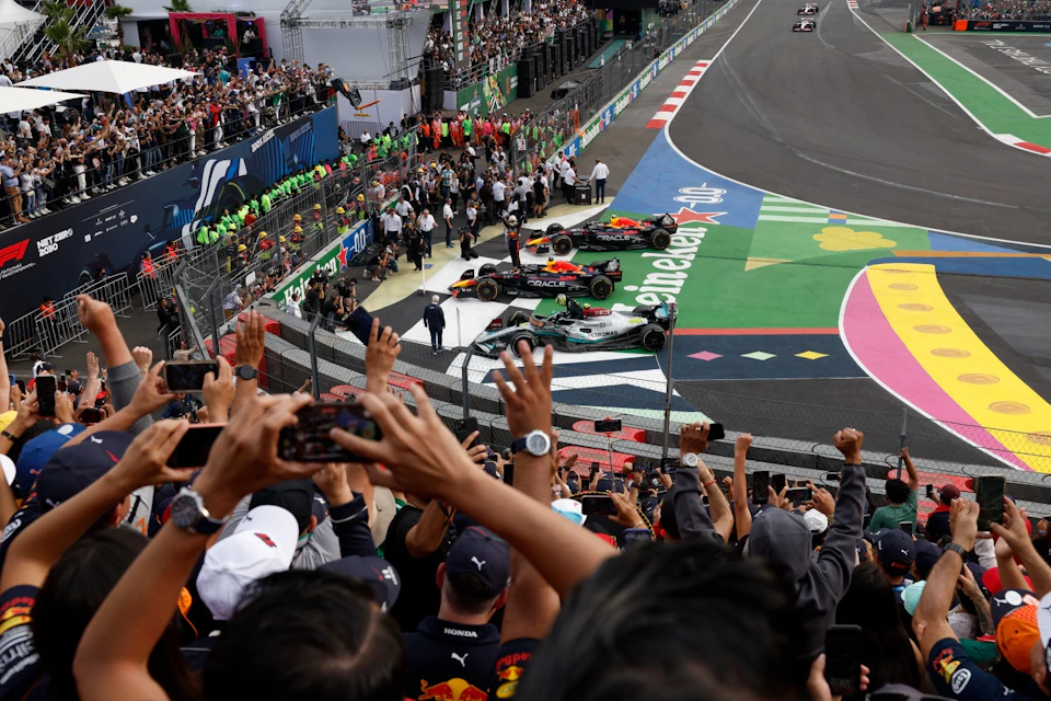 A view from fans celebrating the first, second, and third place winners of the Mexican Grand Prix