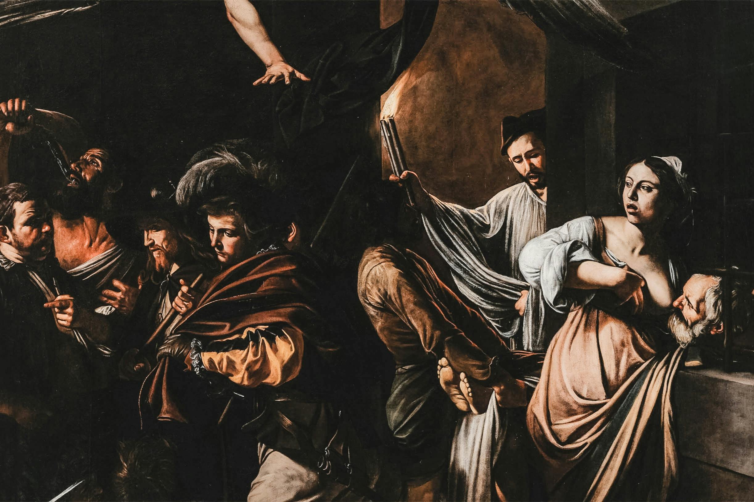 一个戏剧性的场景，几个人，包括一个女人抱着一个男人的头，用一根蜡烛点燃。