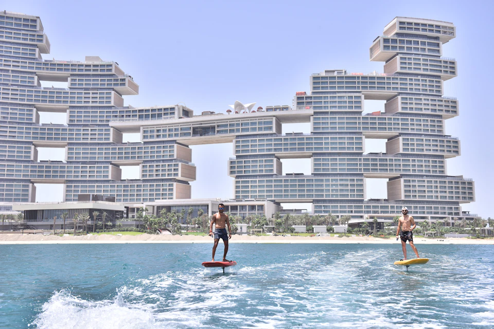 Fly in front of iconic sites like the new 6-star Royal Atlantis.