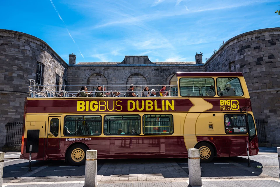 View of a Big bus dublin bus with tourists seating on the open deck around dublin