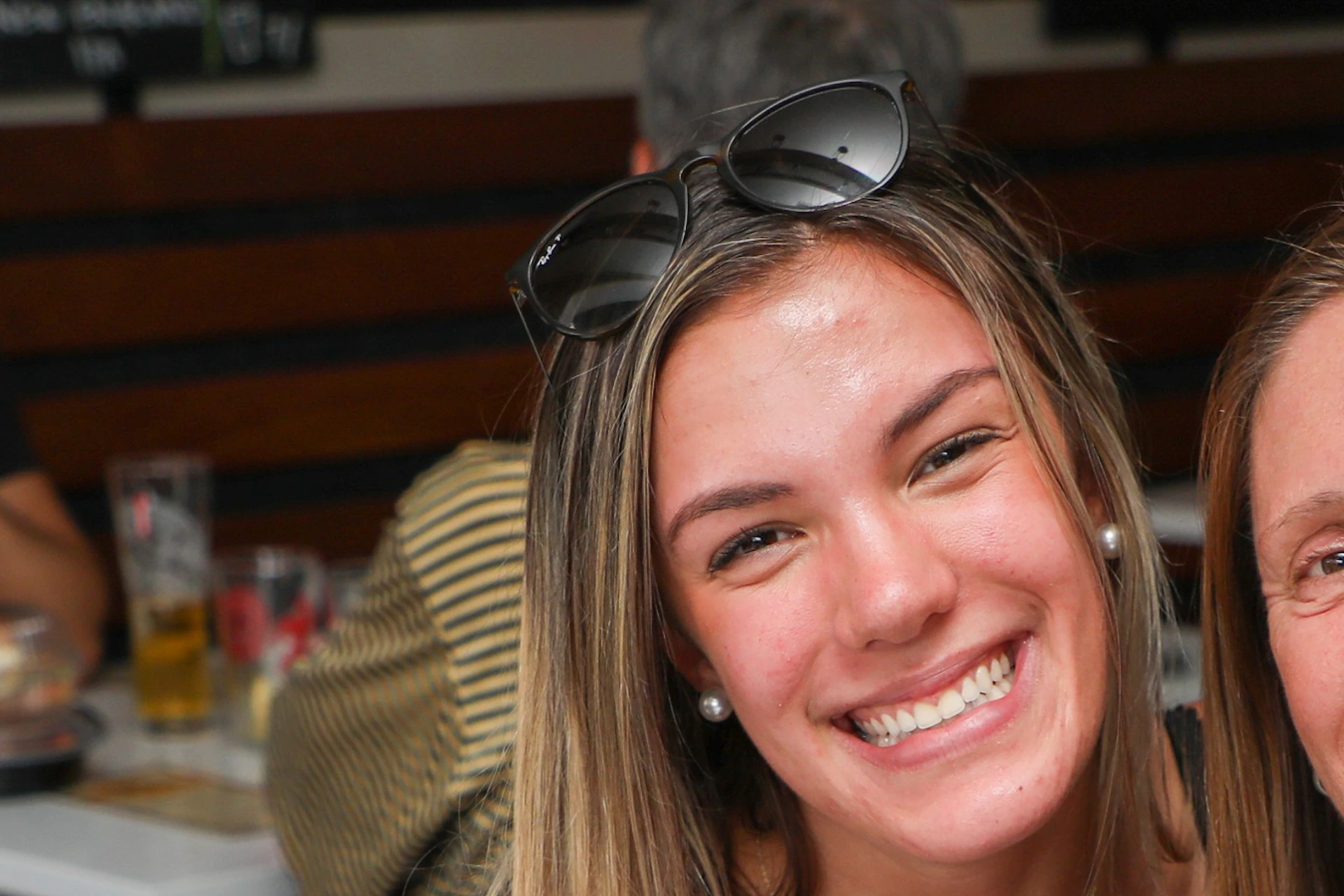 Smiling with gourmet pizza