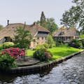 The best scenic spot in Giethoorn is the canals, thatched roof farmhouse, and arch-shaped wooden bridges.