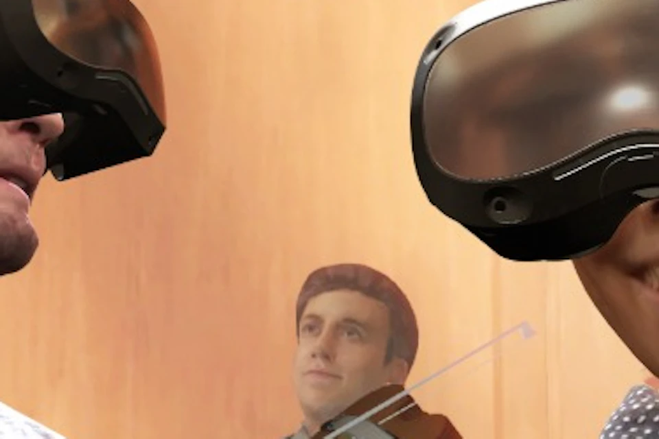 A group of people wearing VR headsets in an ornate, historical-style room with wooden details and a domed ceiling.