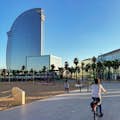 La Barceloneta with its beach, palm trees and the prestigious W Barcelona hotel.