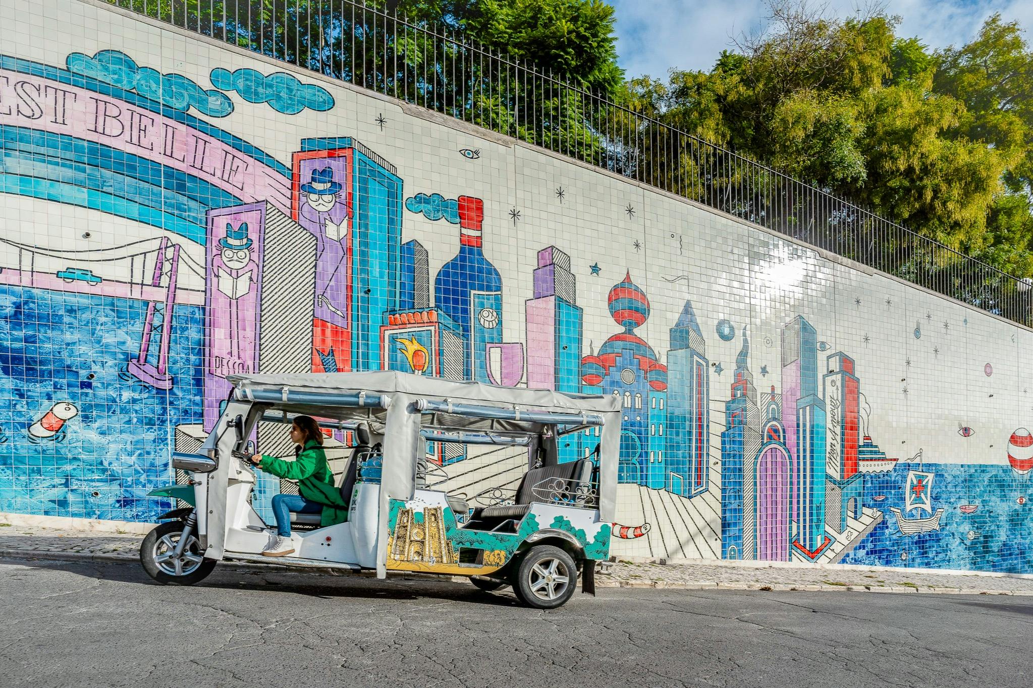 Tourists on a tuk tuk guided tour in Lisbon