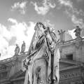 Artistic black and white photo of one of the main statues in St. Peter's Square.