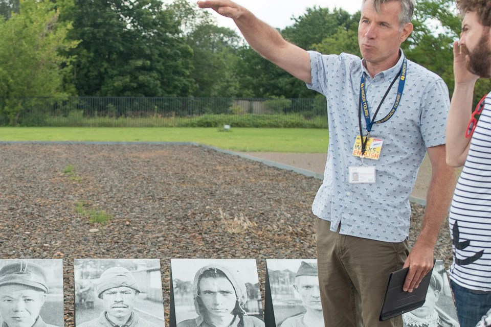 Guide and guests at Sachsenhausen Concentration Camp memorial