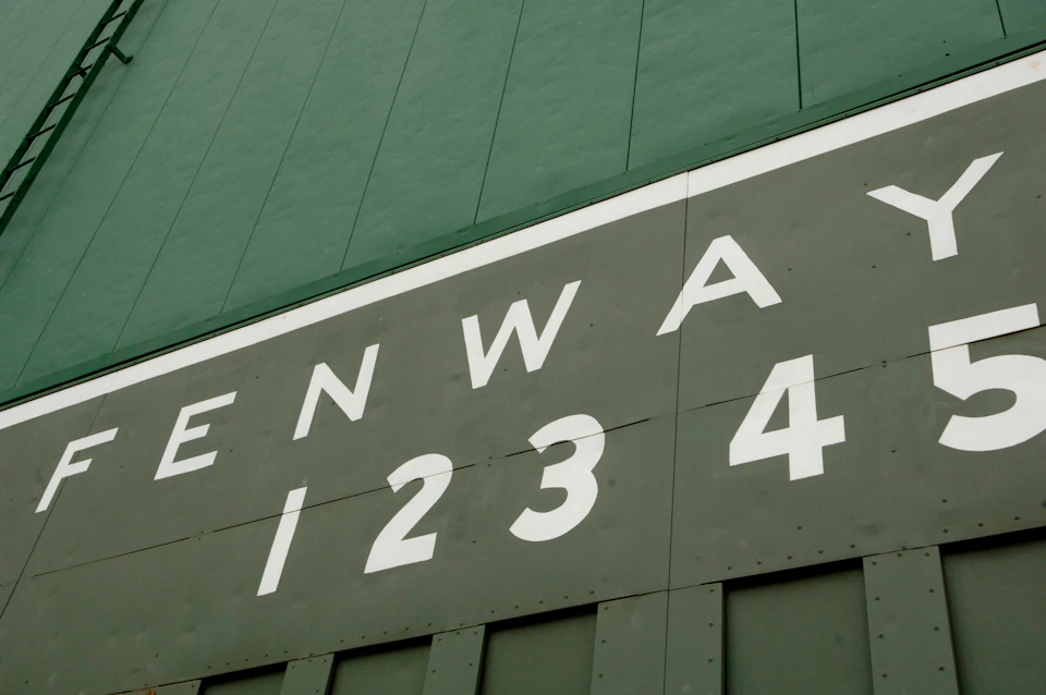 Part of a green wall with "FENWA" and the numbers "1 2 3 4" in large white letters.